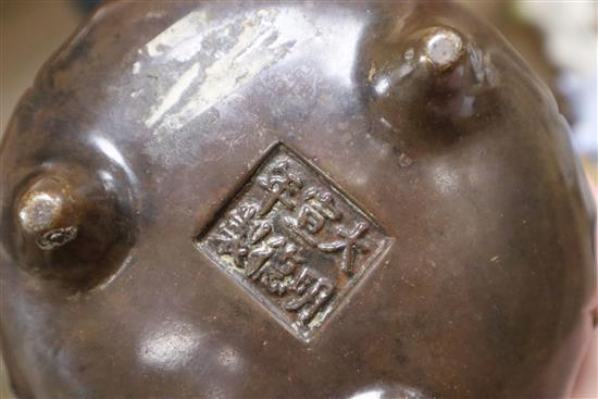 A Chinese bronze tripod censer and stand